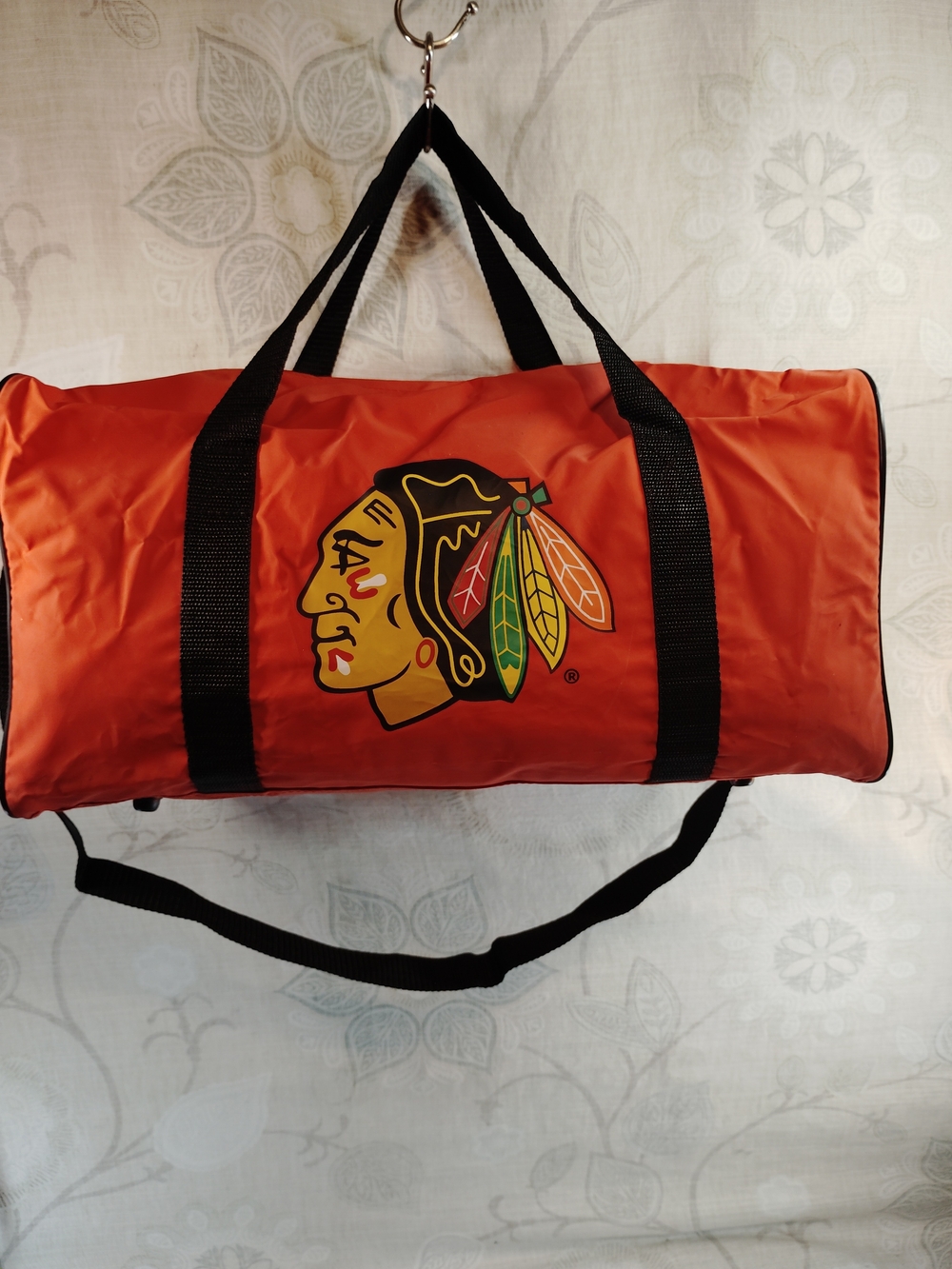 NHL Blackhawks Orange Duffel Bag with Team Logo and Black Straps